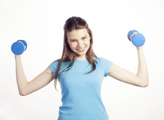young pretty slim woman with dumbbell isolated cheerful smiling