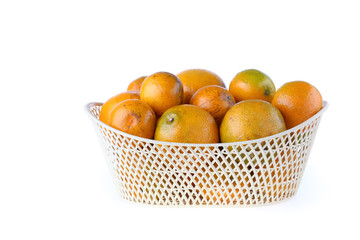 orange fruit in basket, isolated on white background