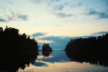 Obraz premium Wild nature of Russian North. Lake and pine trees.