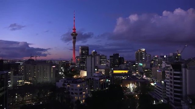 Auckland financial center skyline CBD with the Sky Tower at dusk New Zealand