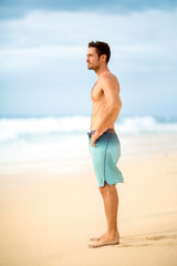 Handsome muscular man on beach
