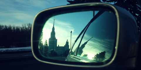 Fototapeta premium Reflection In A Rearview Mirror. Moscow State University building.