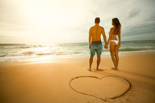 Walk on the beach of loving couple