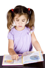 little girl reading book