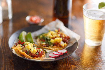 al pastor street tacos with pineapple and beer