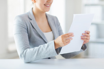 close up of woman reading papers or tax report
