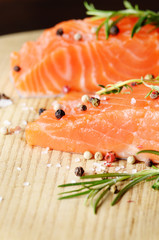 Raw salmon on cutting board