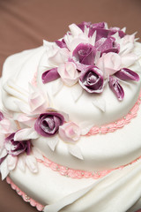 A beautiful wedding cake with roses.