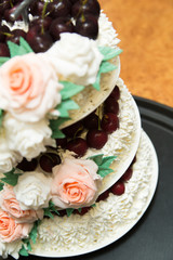 A beautiful wedding cake with roses.