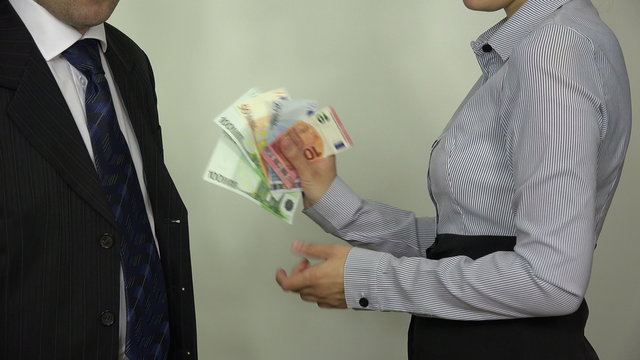 Fancy woman take euro cash banknotes from boss pocket. Business people on white background. Money extortion. Closeup shot. 4K UHD video clip.
