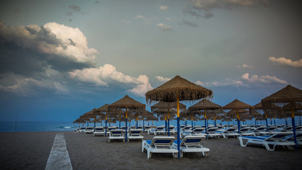 evening calmness on the beach with blurred people and vignetting