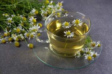 cup of chamomile tea with flowers