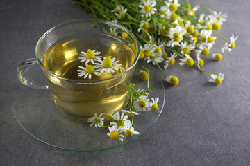 cup of chamomile tea with flowers