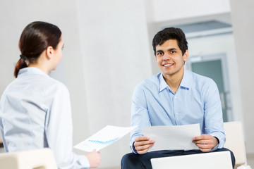 Two young people working as partners