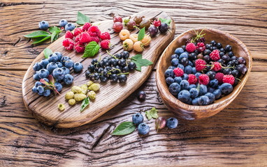 Ripe berries on the old wooden plank.