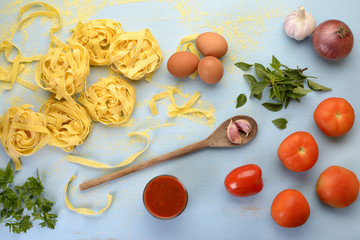 Fototapeta na wymiar Homemade Pasta and Tomato Sauce - Preparation
