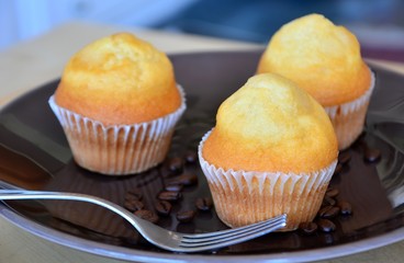 Delicious Homemade Muffins On A Brown Plate