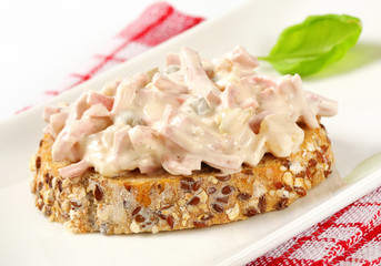 Open faced ham and potato salad sandwich