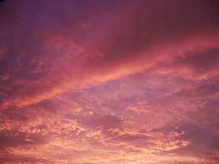 Naklejka na ściany i meble Sky with dramatic cloudy sunset and sun