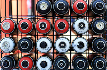 Spray cans of paint for graffiti on the wall