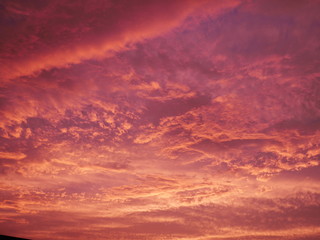 Sky with dramatic cloudy sunset and sun