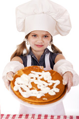 Beautiful happy seven year old girl in chef uniform with shortca