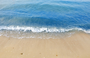 Fototapeta na wymiar Beautiful white sand beach and tropical turquoise blue sea. View