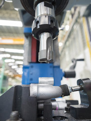 operator machining automotive parts by machining center