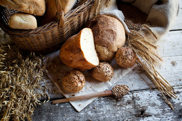 fresh bread and wheat on the wooden table