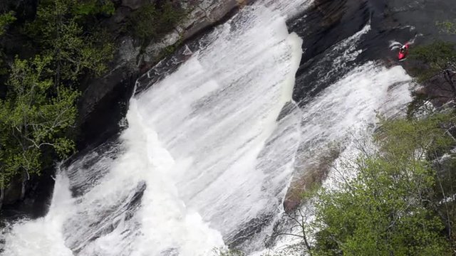 A red kayak tackles Oceania Falls in the Tallulah Gorge