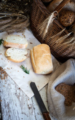 fresh bread and wheat on the wooden table