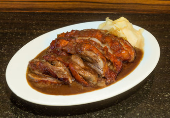 Delicious Roast Duck on stone background