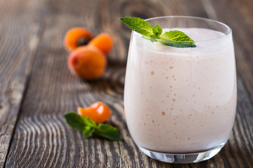 Homemade fresh summer fruits smoothie with ripe apricots