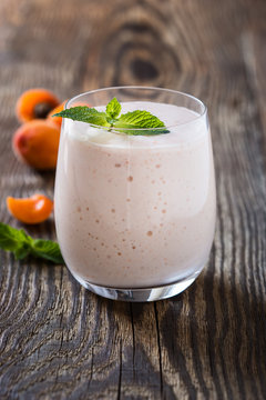 Homemade fresh summer fruits smoothie with ripe apricots