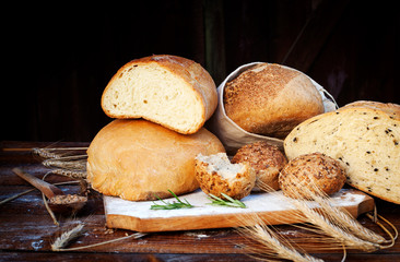 fresh bread and wheat on the wooden table