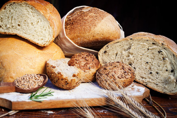 fresh bread and wheat on the wooden table