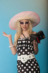 Blonde girl posing in the beach style