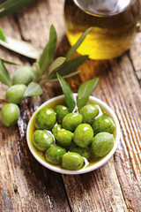 Olive oil with fresh olives
