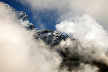 Fototapeta na wymiar Clouds, ice and snow caps on Eiger,near Grindelwald, Switzerland