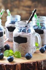 Healthy smoothies from organic blueberry, banana and oatmeal with natural yogurt