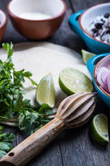 Making traditional mexican burritos with pulled beef