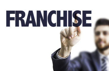 Business man pointing the text: Franchise