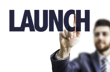 Business man pointing the text: Launch