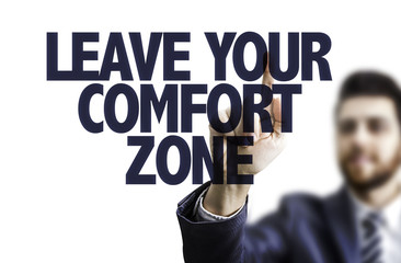 Business man pointing the text: Leave Your Comfort Zone