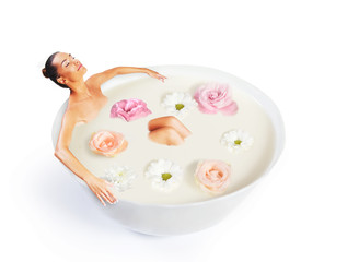 Woman taking a bath in scented milk