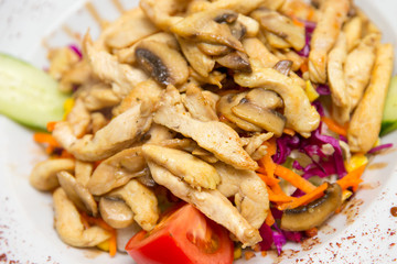 Vegetable salad with roasted chicken meat