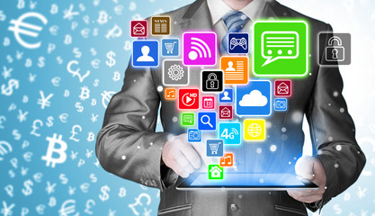 Business man using tablet PC with social media icon set