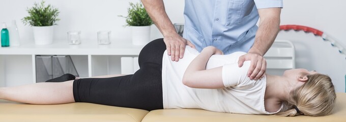 Chiropractic examining patient