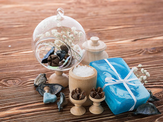 spa stuff on wooden background: candle, aroma