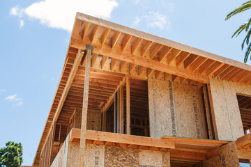 New home under construction in Los Angeles, USA against blue sky